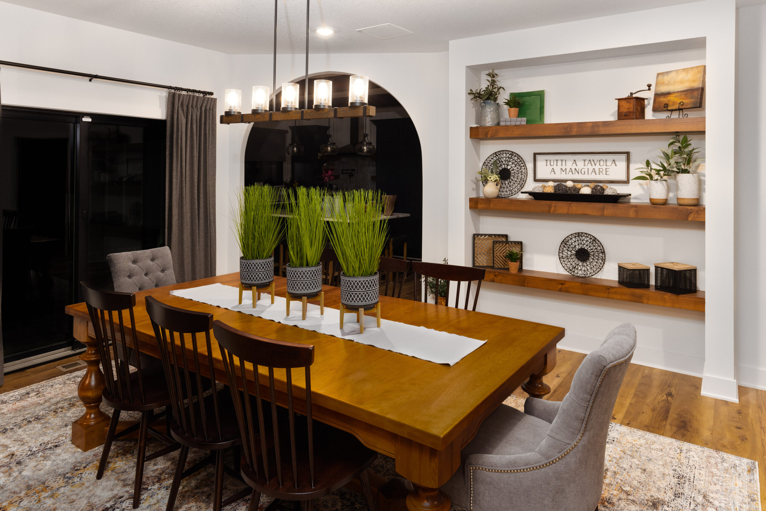 Rustic Italian dining room design with plants and accessory placement by Room Reimagined Design